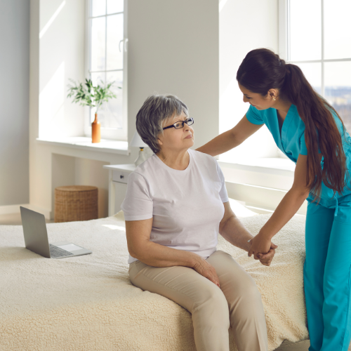 assisting woman with dementia get into bed